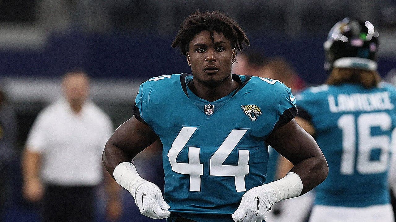 Former NFL standout climbed out of second-story window, fell before facing gun charges, police say