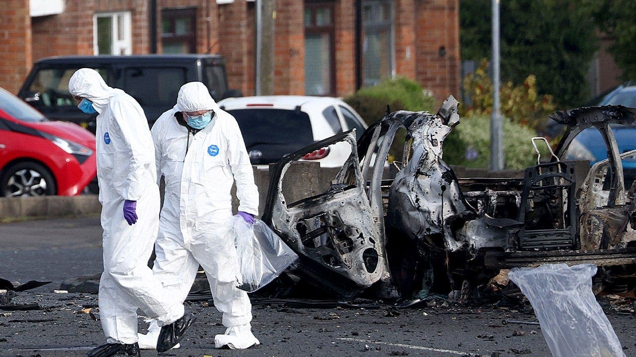 New IRA claims responsibility for car bomb outside Dunmurry police station; authorities cite alleged links to Iran and Hezbollah