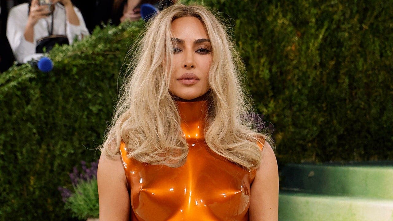 Kim Kardashian posts bikini photos on Instagram and shares first Instagram feed photo with Formula 1 driver Lewis Hamilton