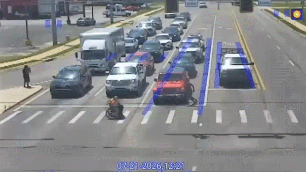 Spider-Man-Costumed Driver Helps Wheelchair User Cross