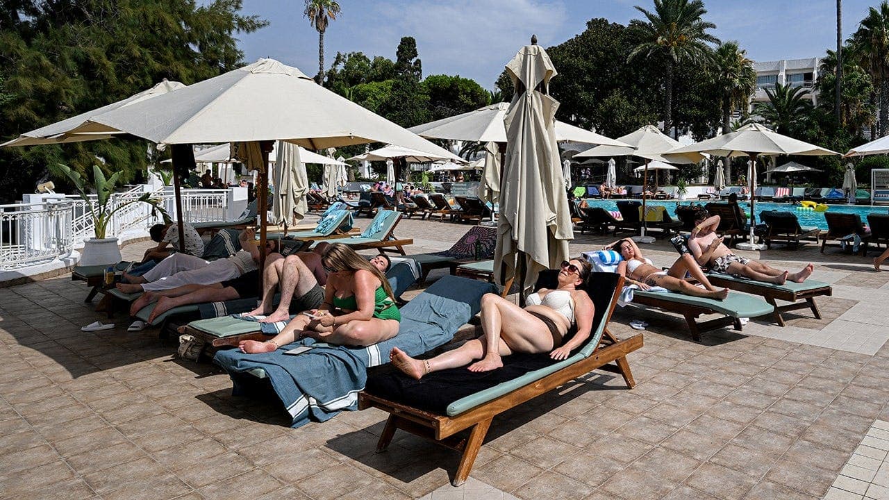 Tourists Race for Pool Loungers at Spanish Resort