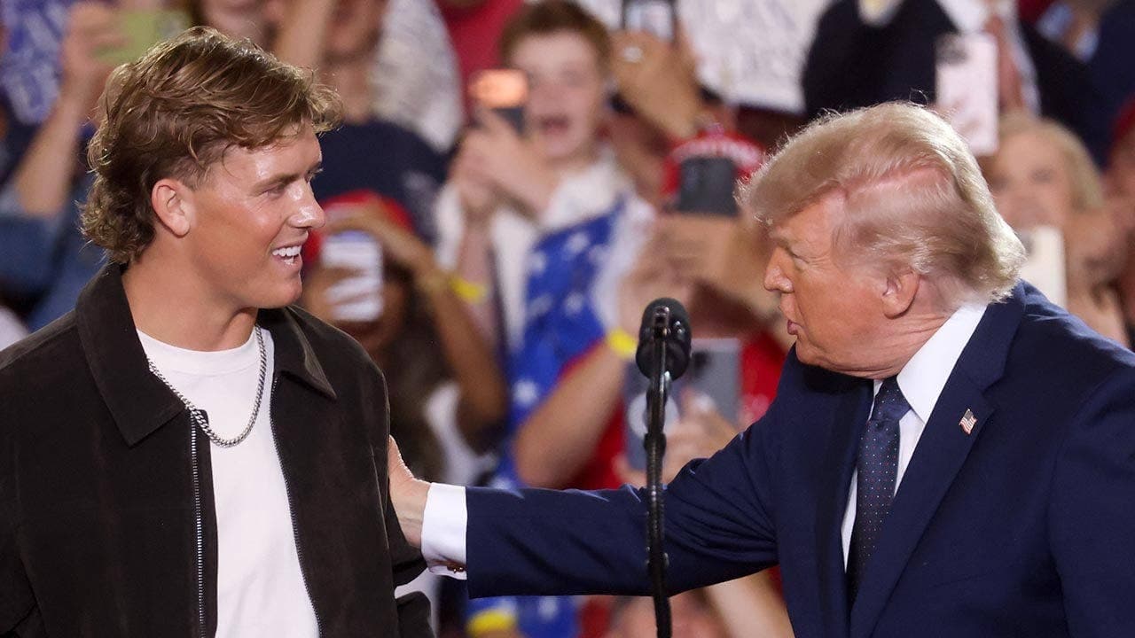 Trump praises New York Giants quarterback Jaxson Dart after Dart introduced him at Suffern, N.Y.; teammate Abdul Carter criticizes the decision