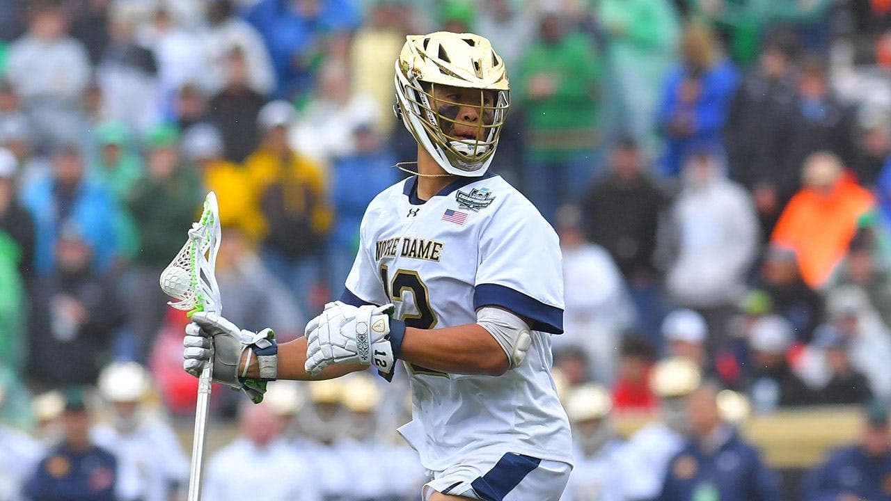 Air Force graduate and Space Force second lieutenant Josh Yago salutes during national anthem before Notre Dame–Princeton NCAA men's lacrosse championship on Memorial Day